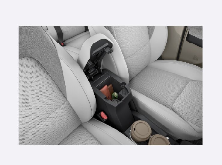 Tata Aeris CNG Soft-Touch Leatherette front armrest with storage