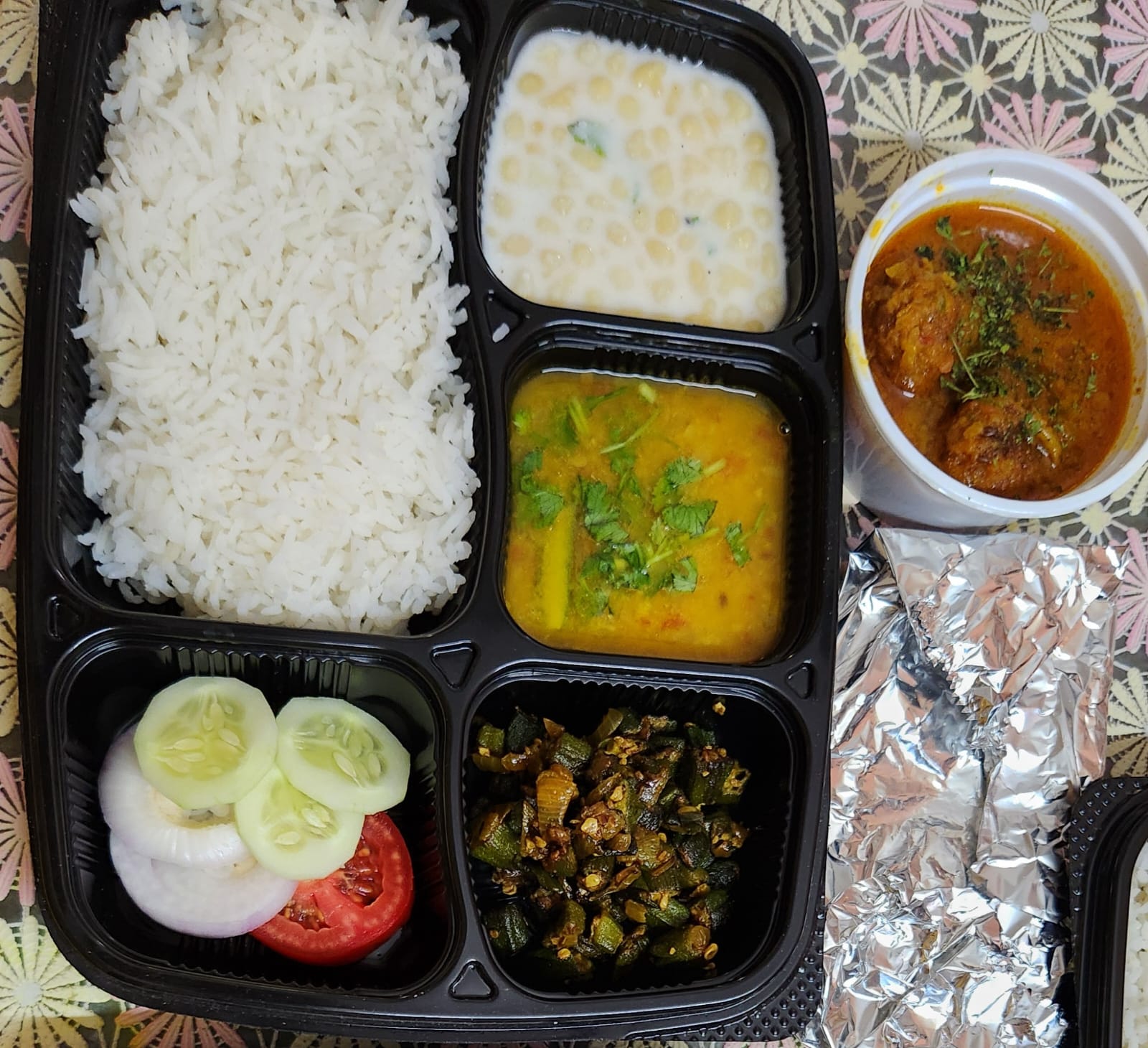 Bengali Fish Lunch Box. dal, seasonal bhaji, fish curry